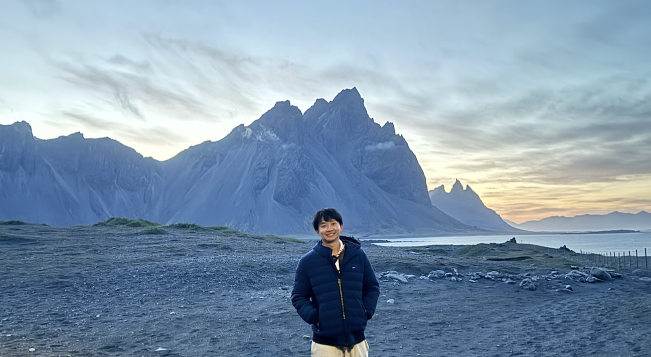 Allen in Iceland with dramatic mountain landscape